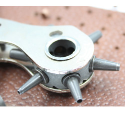 Revolving round punch